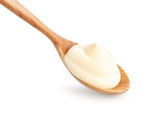 Tasty mayonnaise sauce in wooden spoon isolated on white