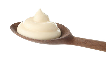 Tasty mayonnaise sauce in wooden spoon isolated on white