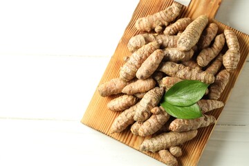 Tumeric rhizomes on white table, top view