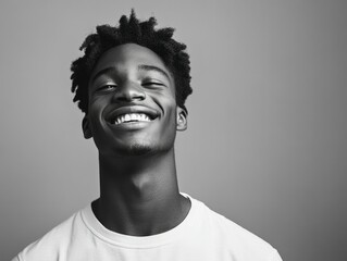 Smiling Young Man with Short Hair and Afro-inspired Haircut