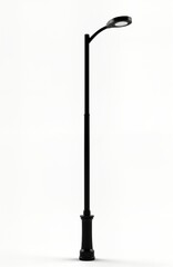 Modern street light pole stands tall. Black metal construction. Stylish design. Energy efficient LED light illuminates street. Urban city structure. Durable material. Public safety. Public space.