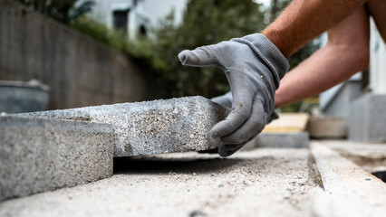 Laying concrete pavers