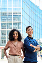 Vertical portrait of young happy professional corporate office team of two diverse confident female...