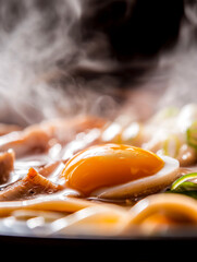 Extreme close-up of tonkotsu ramen with chashu pork and soft-boiled egg