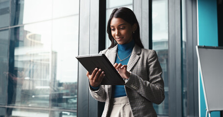 Typing, tablet and planning with business woman in office for workshop coordinator, reading and corporate trainer. Feedback, research and conference organizer with person in agency for schedule © peopleimages.com