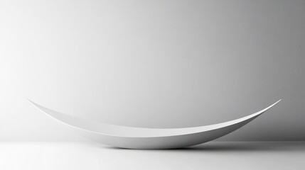 Minimalist white curved bowl on white background.