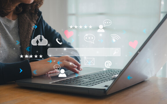 Closeup of woman hand using laptop to work on futuristic social media marketing for internet network technology and online business concept. Search Engine Optimisation. SEO. SMM. Video Advertising.