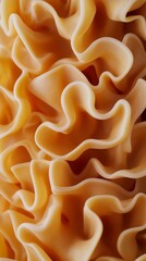 Close-Up of Golden Pasta Waves, Abstract Food Texture