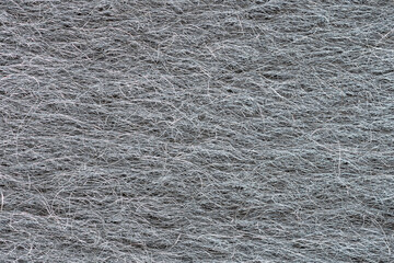 Closeup shot of stove glass cleaning sponge metal fibers