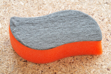 An Orange Stove Glass Cleaning Sponge