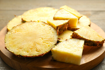 Slices of fresh ripe pineapple on table, closeup