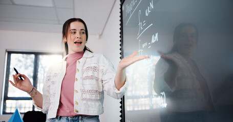 Education, woman and student by board in classroom explaining science equation at college....