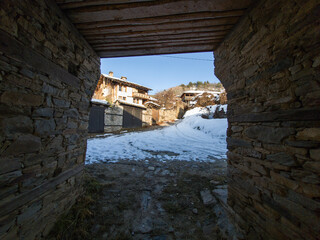 Fototapeta premium Winter Sunset view of Village of Kovachevitsa, Bulgaria
