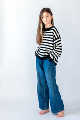 Portret of a cute child girl on the gray background