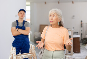 Fototapeta premium Portrait of an emotional mature woman who came to the apartment to check the repair work in the house