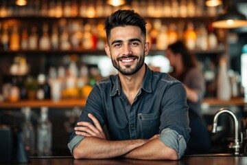 Fototapeta premium portrait of a young smiling Lebanese male bartender against blurred bar background
