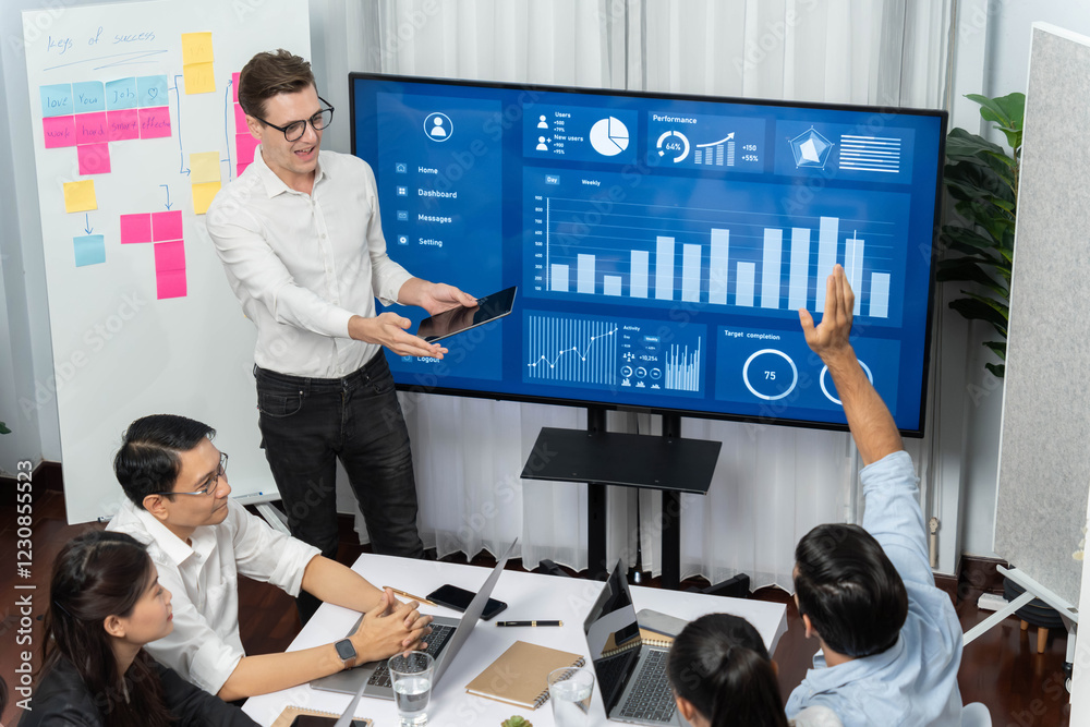 Leinwandbilder Presentation in office or meeting room with analyst team utilizing BI Fintech to analyze financial data. Businesspeople analyzing BI dashboard power display on TV screen for strategic planning.Prudent