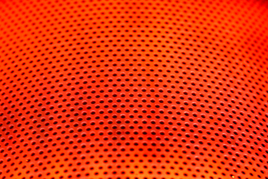 Extreme closeup shot of the red-hot surface of a campstove