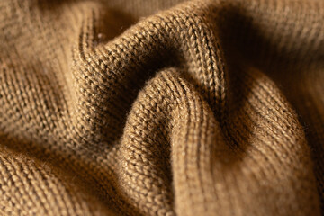  Mocha coloured knitted fabric with waves and selective blur.