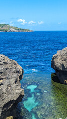 Crystal-Clear Water Between Volcanic Rocks