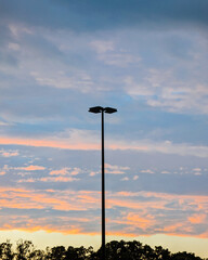 Streetlight Silhouette Against Vibrant Sunrise/Sunset Sky