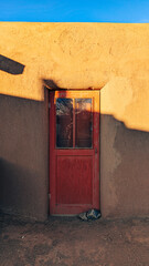Rustic Adobe Door with Warm Sunset Shadows