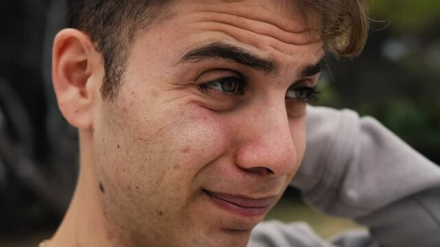 Boy Makes Intimidated And Ashamed Expression In Nature In A Park