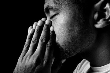 Generated Image black and white portrait of a young man praying thinking