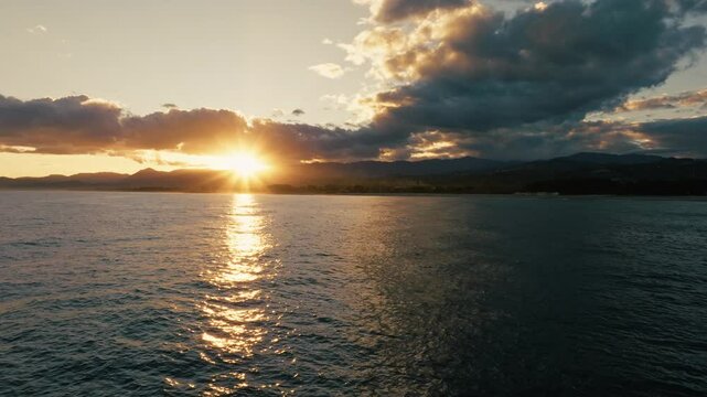 Sun And Religious Celestial Clouds Over Calm Ocean For World Peace