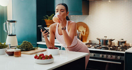 Phone, kitchen and woman drinking smoothie in home for health, wellness and liquid breakfast....