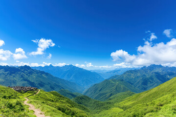 Naklejka premium A mountain range with a clear blue sky and a few clouds