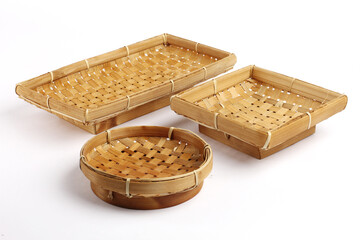 A set of handcrafted bamboo baskets in different shapes displayed on a white background, showcasing traditional weaving patterns and natural materials suitable for product or craft themes.