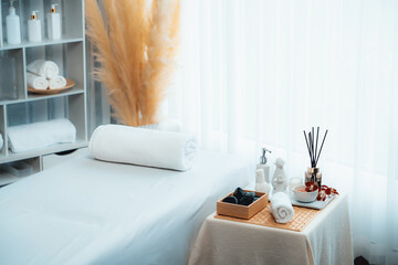 Exquisite display of beauty treatment and spa salon accessories arranged on spa table in luxury spa...