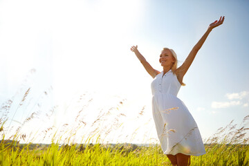 Freedom, nature and woman with open arms on vacation for travel, holiday and mockup space on sky. Outdoor, peace and person with hands outstretched for fresh air, adventure and smile in countryside