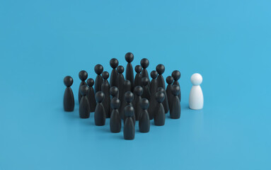 A single white figure stands apart from a group of black figures against a blue backdrop.