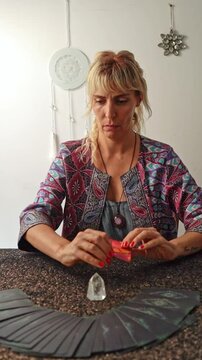 A tarot reader laying out tarot cards