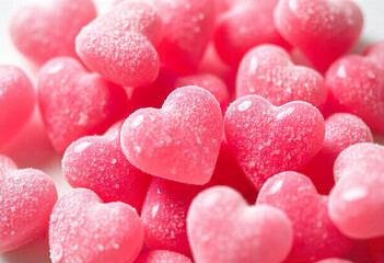 Obraz premium Gummy jelly in the shape of a pink heart on a pink background