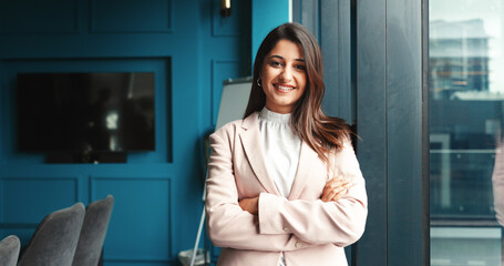 Portrait, confident and woman with arms crossed, office and happy for internship in agency or...