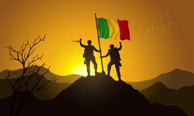 Mali flag, silhouette of two climbers holding a flag at sunset over the mountain
