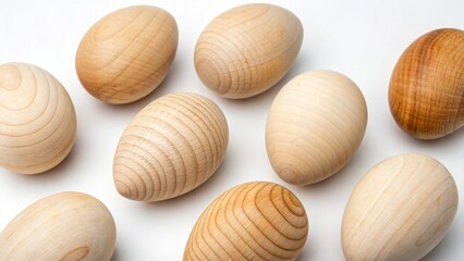 Scattered Wooden Eggs on White Surface 