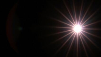 Bright Starburst Lens Flare on Black Background