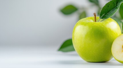 Fresh organic apple showcasing vibrant green hue with leaf detail