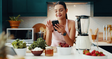 Phone, recipe and woman with smoothie in kitchen for health, wellness and diet breakfast. Happy,...