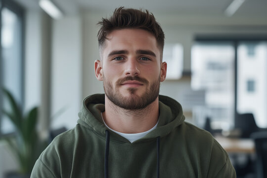 A professional portrait of a young male IT specialist in his late 20s