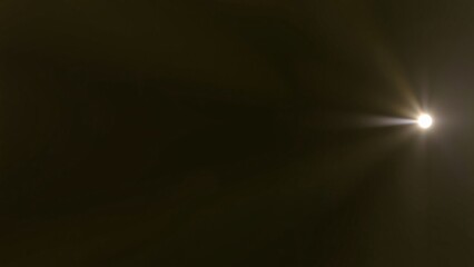 Bright Starburst Lens Flare on Black Background