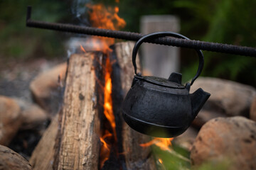 open fire flames boil kettle drink orange 