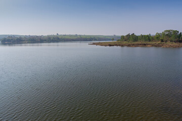 Modern reservoir construction and maintenance Asia. Clean water project for rural areas, showing environmental impact