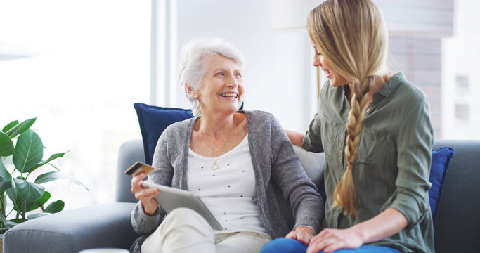 Daughter, senior mother or credit card with tablet in home for online shopping, internet banking support or help. Ecommerce, family or teaching woman with bills payment, sale purchase or subscription