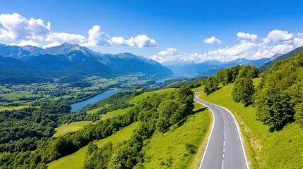 Winding roads and lush forests under the bright mountain sky