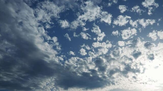 Altocumulus high cumulus heaped cloud genus belongs to stratocumuliform. Globular masses or rolls in layers or patches. Cumuliform stratocumuliform clouds, altocumulus signifies convection. Blue sky.
